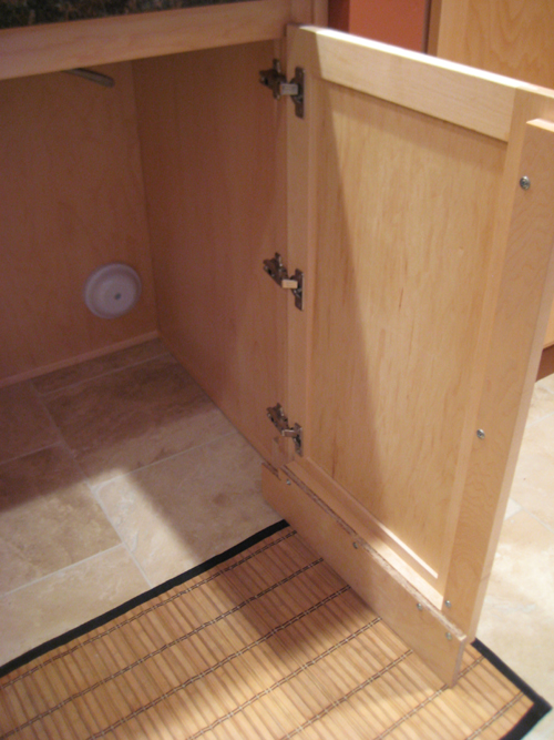 this After image shows an Access Architectural proprietary design for a base cabinet door, that includes the toe kick on the door, for required A D A knee clearance under the sink 
